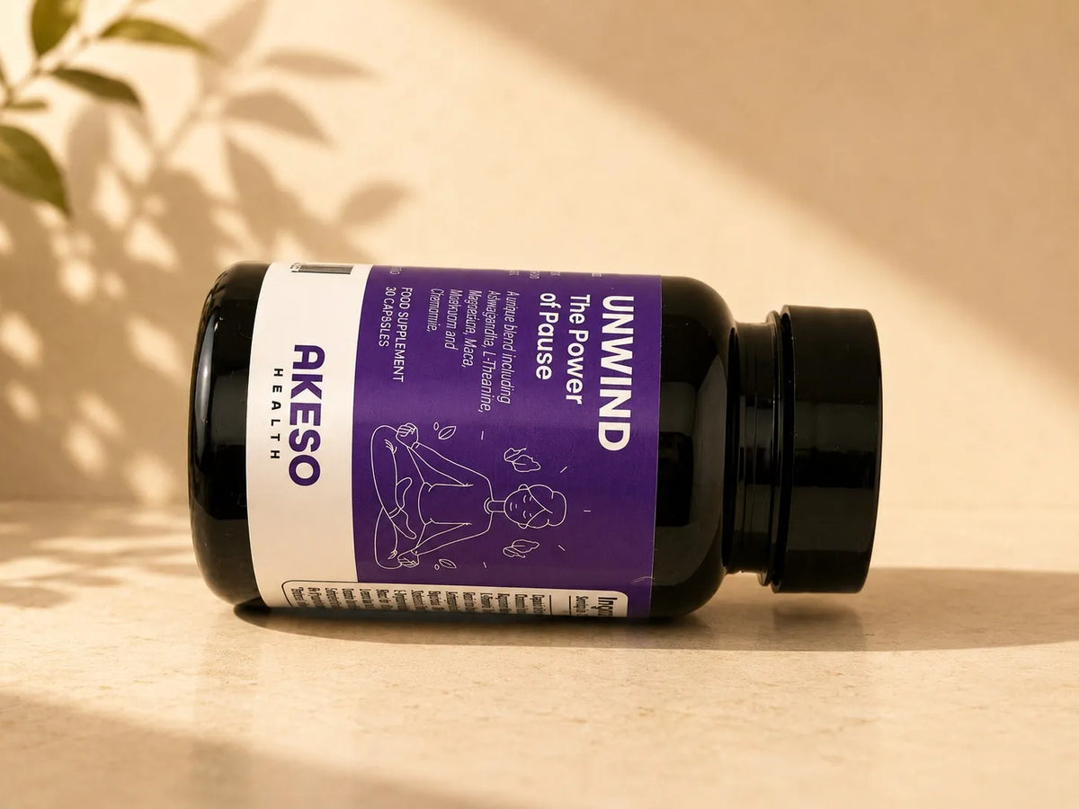 Akeso Health UNWIND bottle lying on its side in warm light